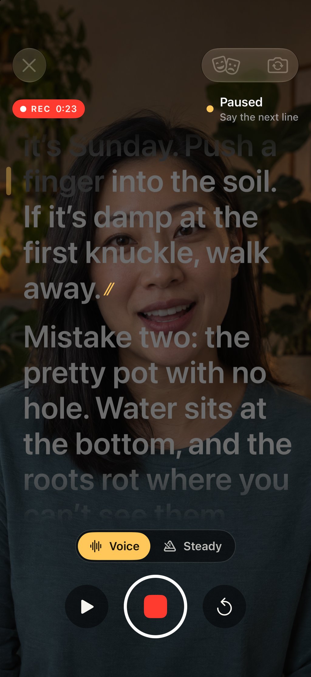 The script held on pause during a recording at 0:23, with the text dimmed over the camera picture and a play button to carry on.